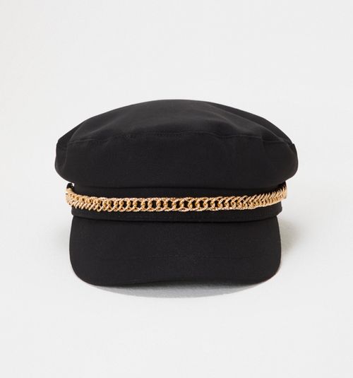 Beret-style hat with decorative item
